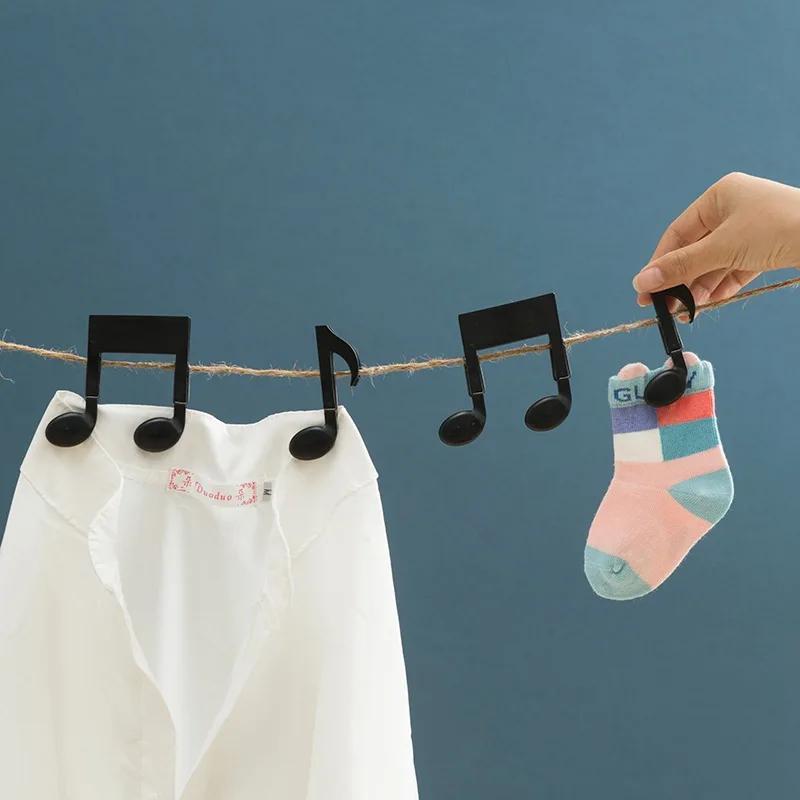 Baby Clothing Drying Rack - 2個入り 音符型洗濯バサミ ブラック スプリングクリップ付き クリエイティブな家庭用衣類ラック 洗濯物整理